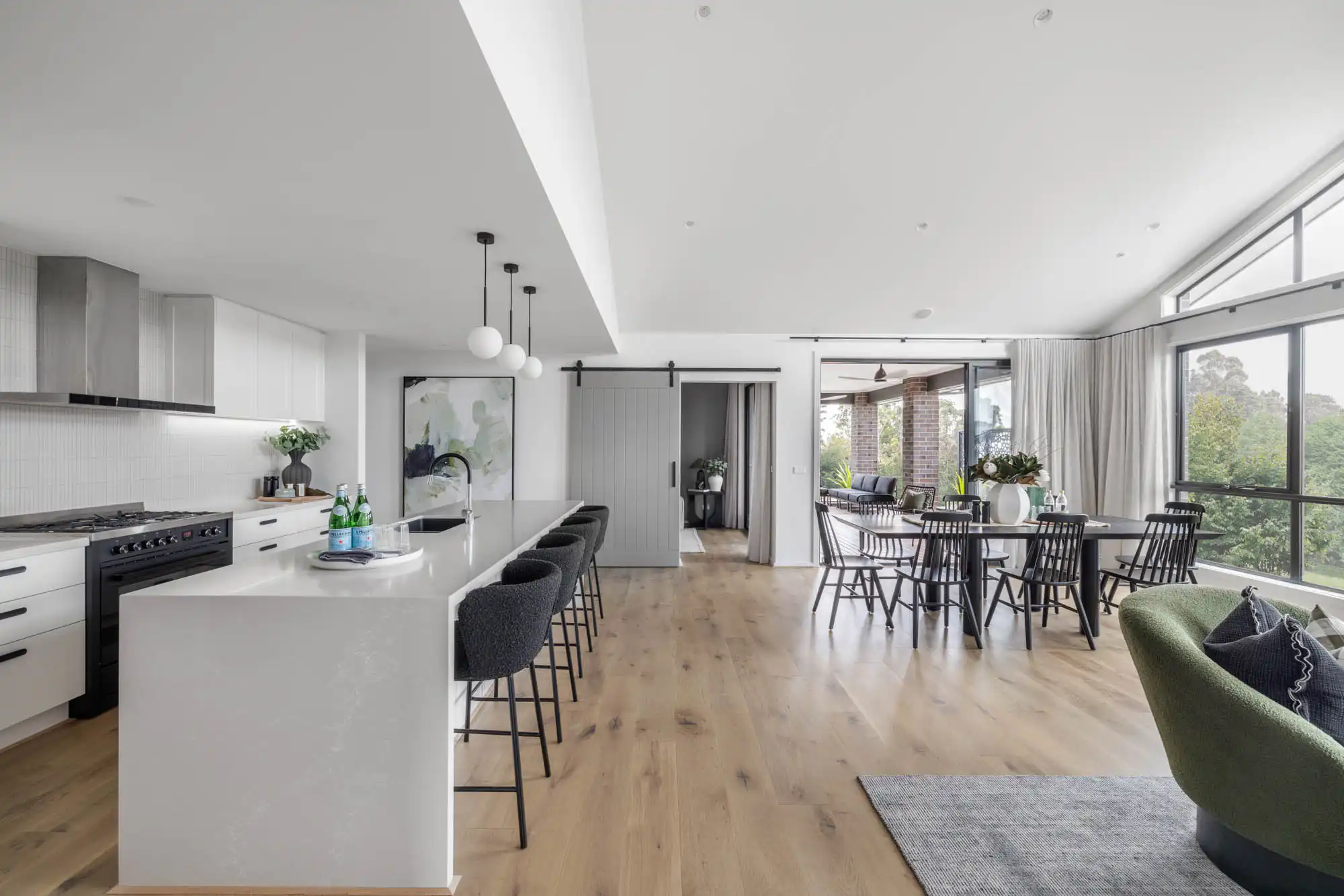 contemporary raised ceiling design with pops of black features and subway tiling backsplash at redhill 30