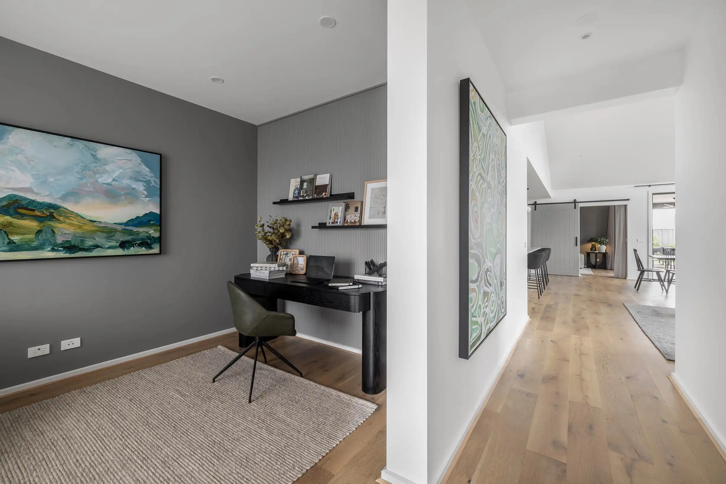 open study space layout inspiration with wide hallways and statement artwork at red hill 30