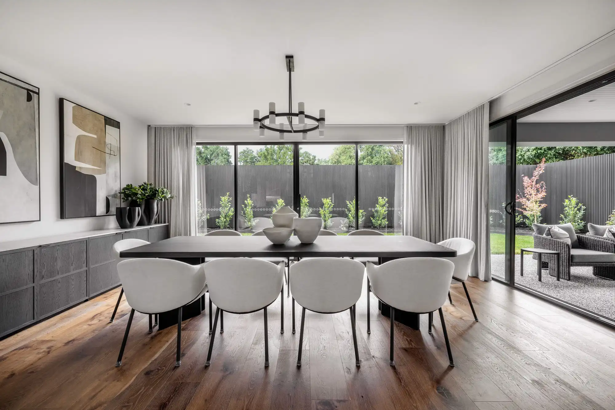 Open plan living at the Durrant Masterpiece home. Featuring sliding doors, to open up the living and dining space more