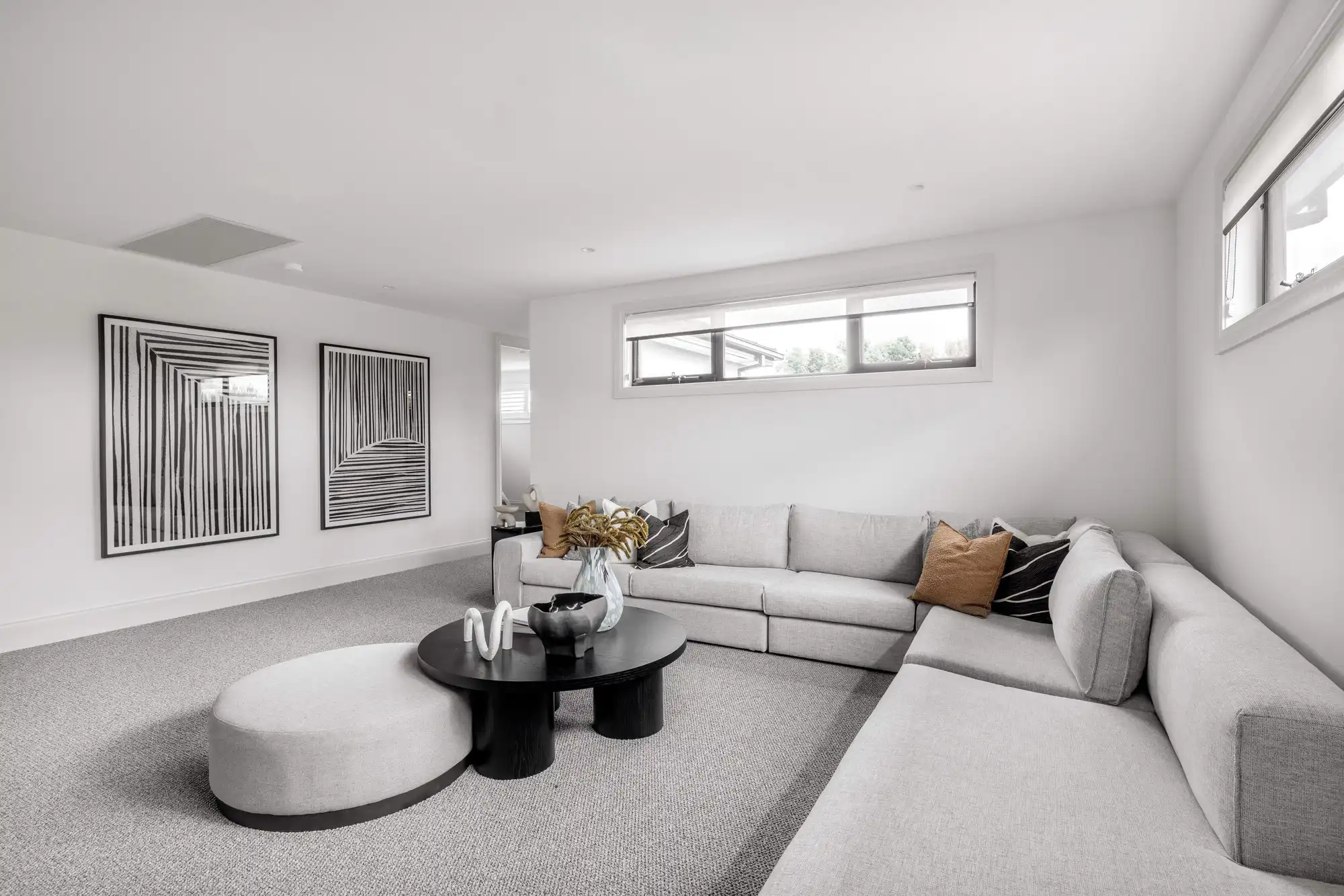 Monochromatic tones for this interior living space at the Durrant Masterpiece home