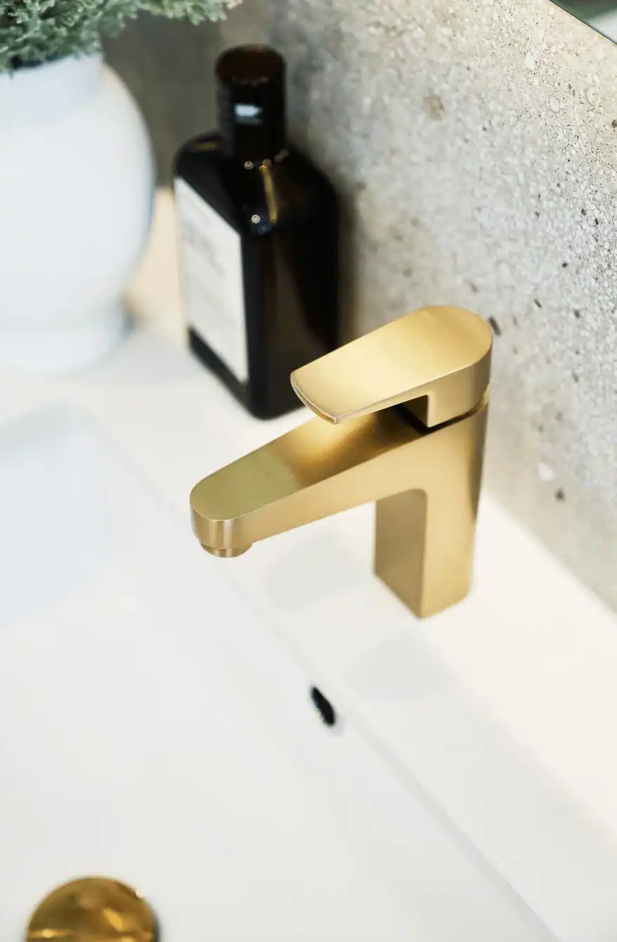 Close up photo of brass tapware in a Simonds Armidale 34 home design