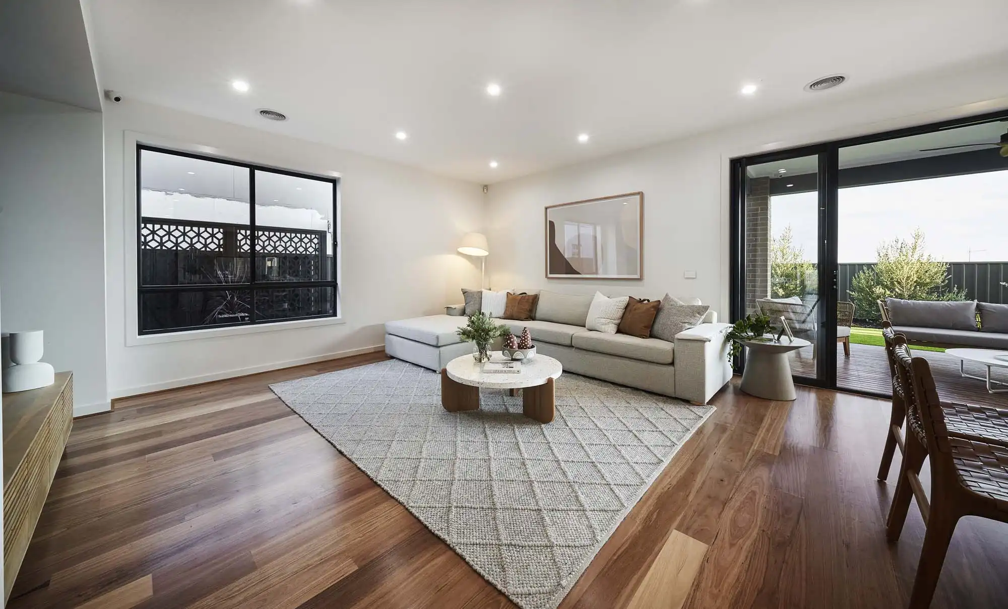 Dark timber flooring throughout the home gives rich contrast to the light and airy furnishing at armidale 34