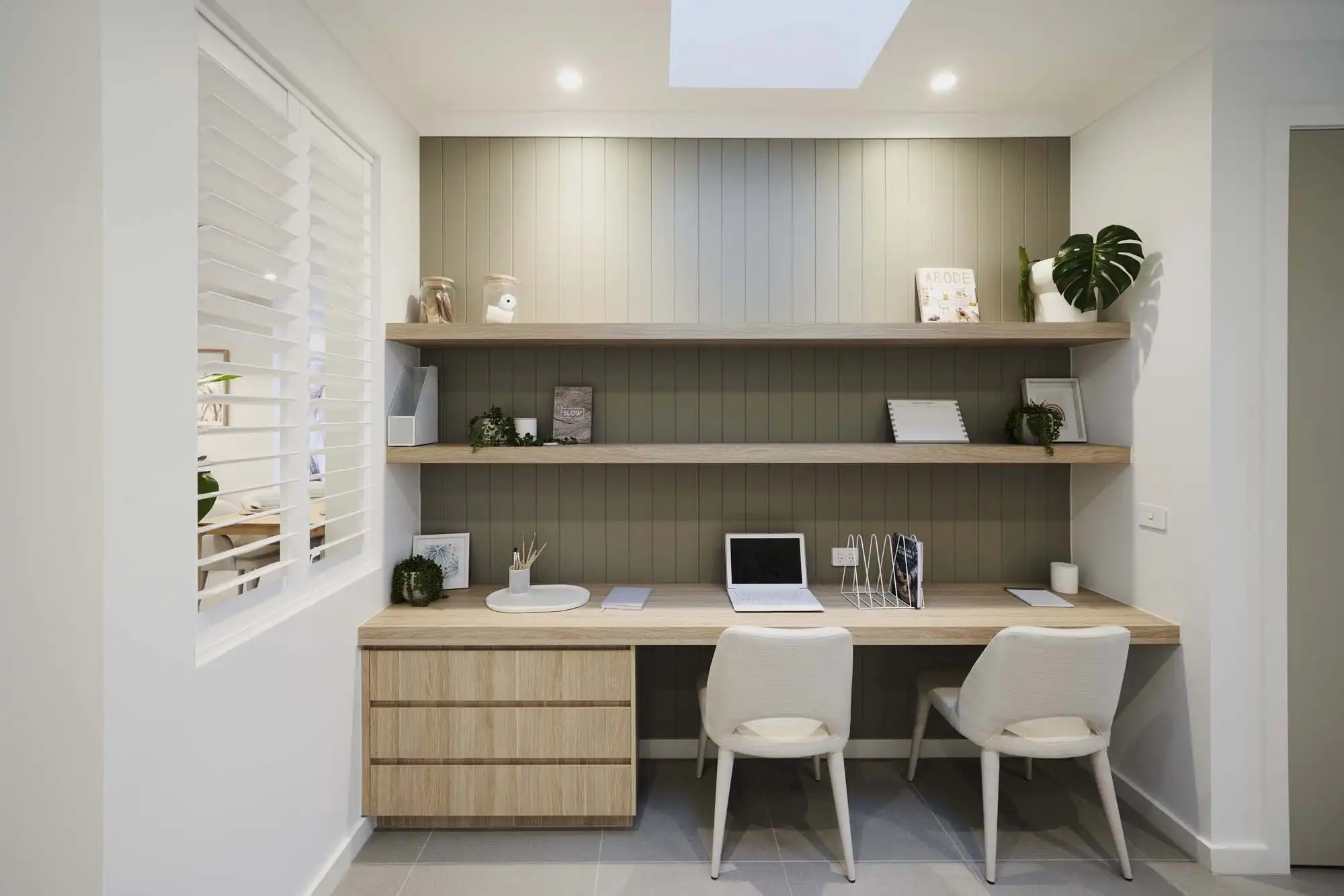 Hidden study space with wood cladding as a feature wall with a built-in cabinetry at balsa 28