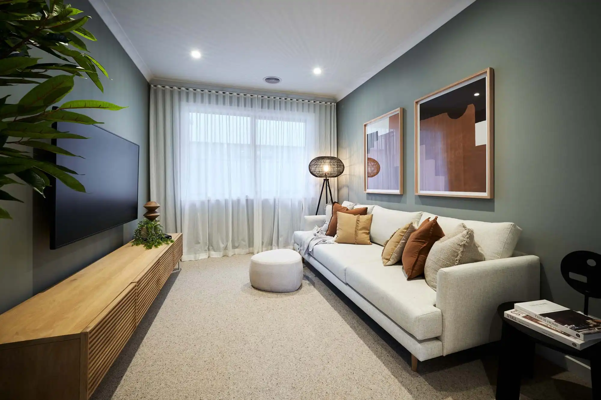 moody home theatre with dark surrounded walls and soft warm lighting at berrima 28