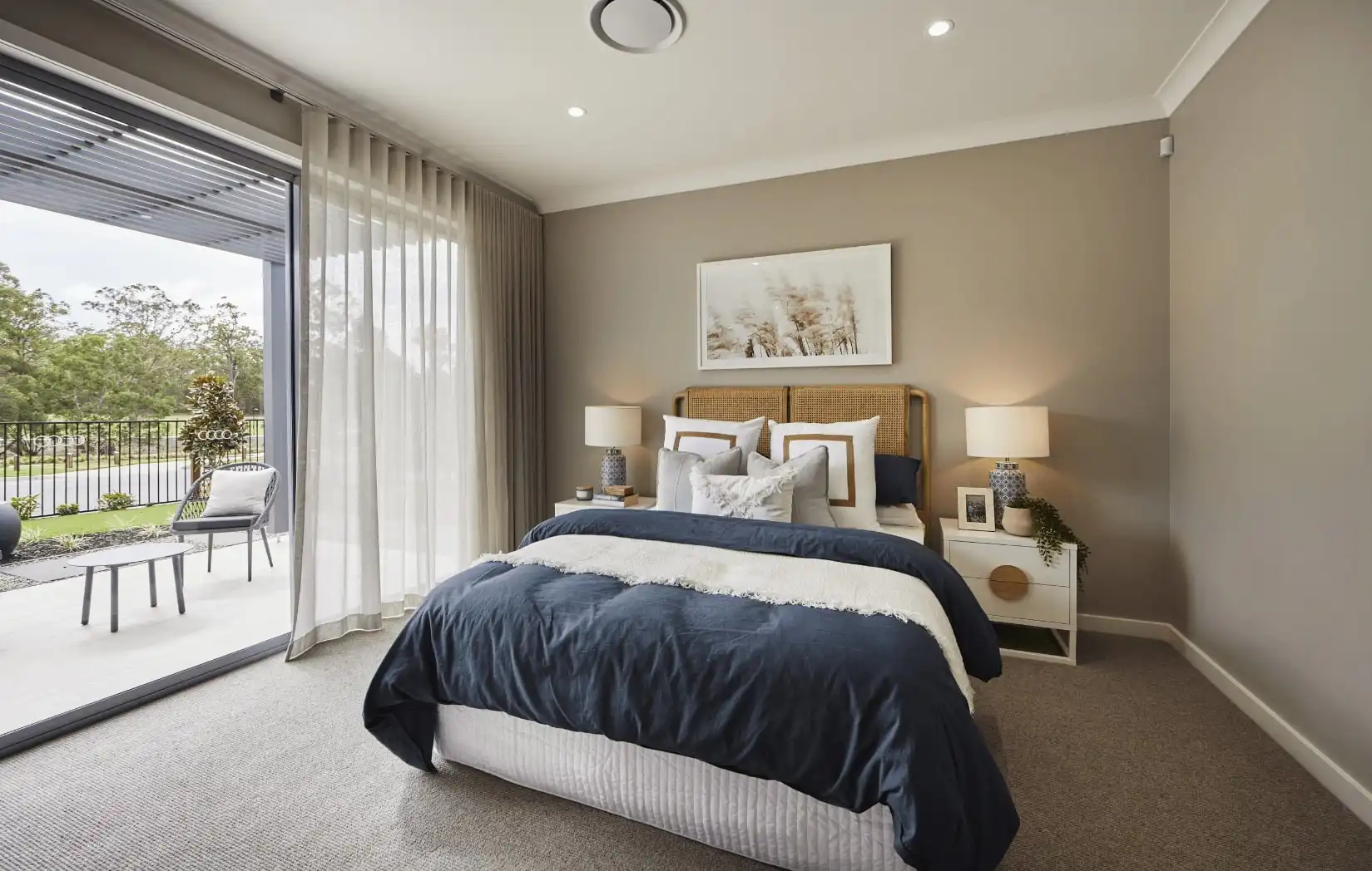 alfresco connecting to the master bedroom with floor to ceiling curtains and neutral toned walls throughout at dalwood 25