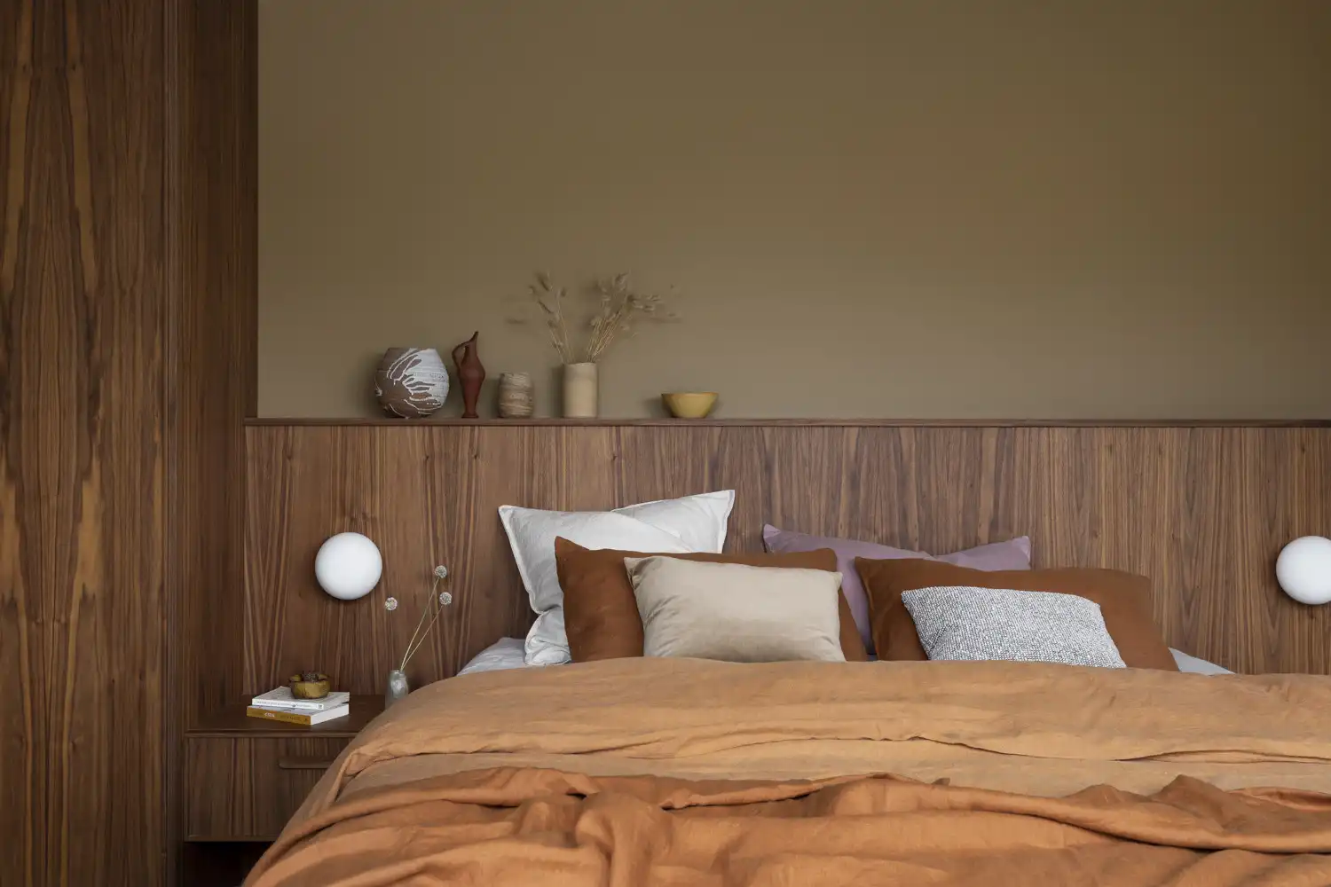 Mid century modern wooden panel interior with built in lamps on each side