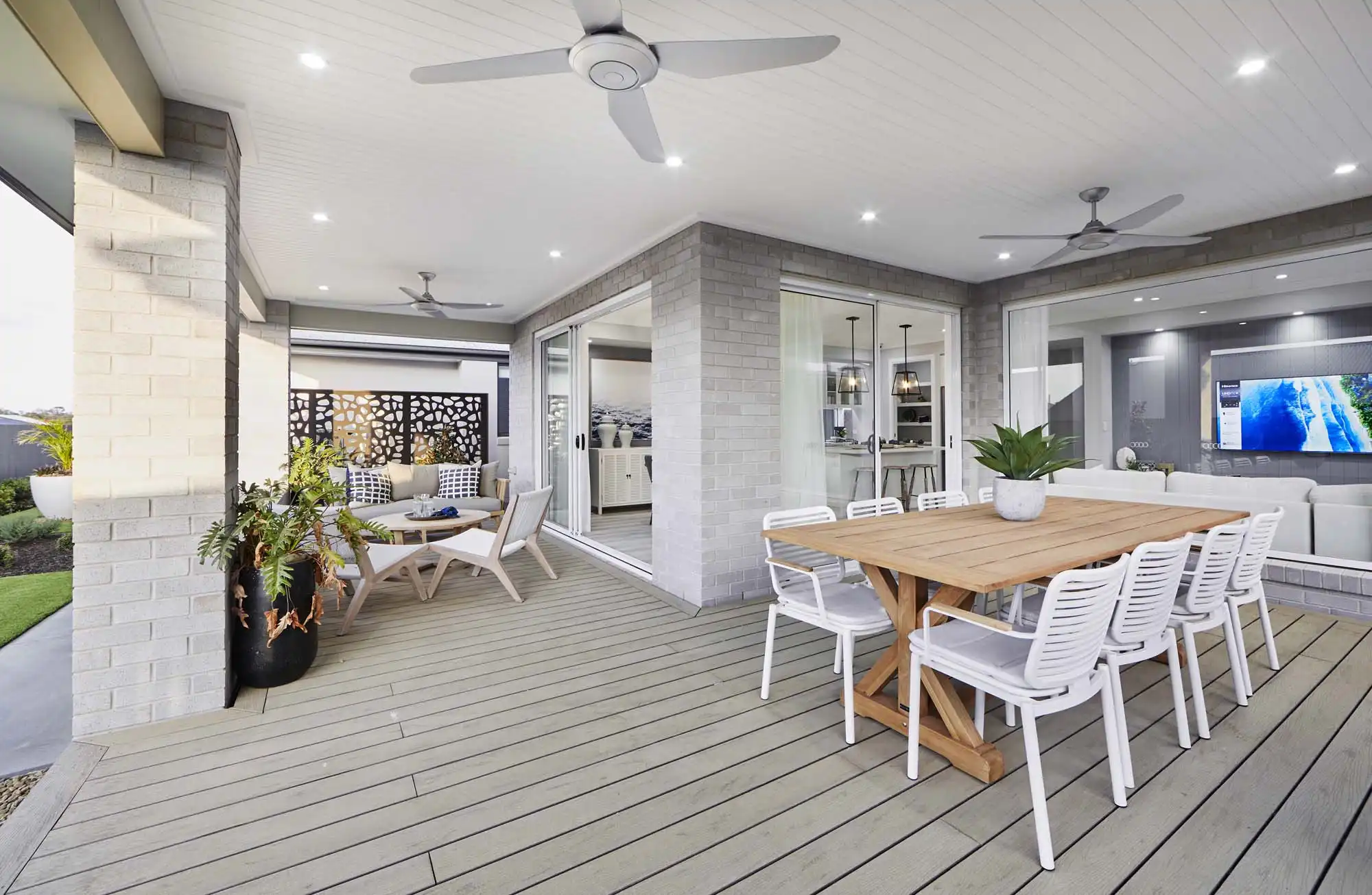 Simonds grey brick design including features like wood cladding on ceiling metal fence panels and timber decking