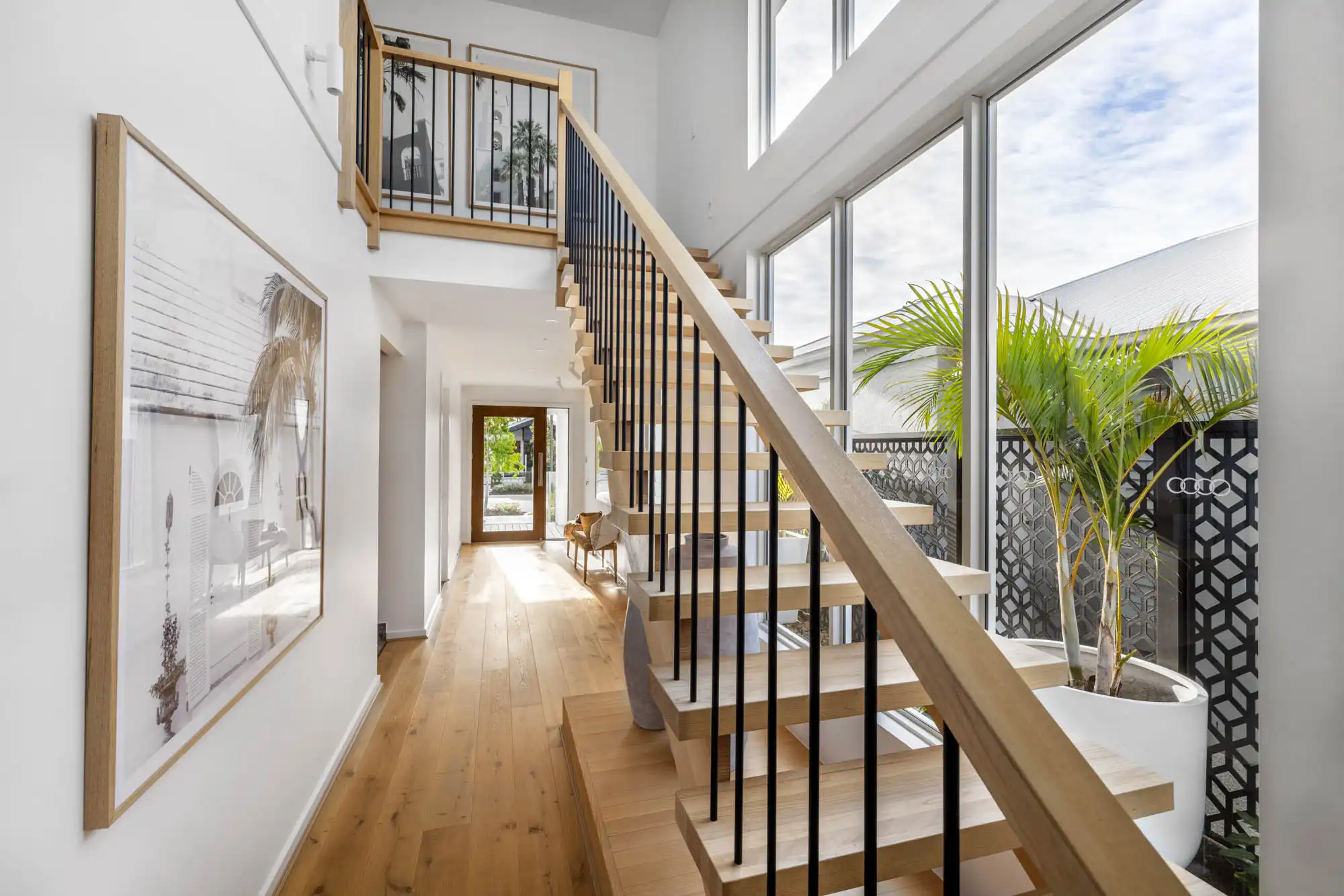 timber flooring and accents gives this travertine 31 home a coastal and stylish atmosphere