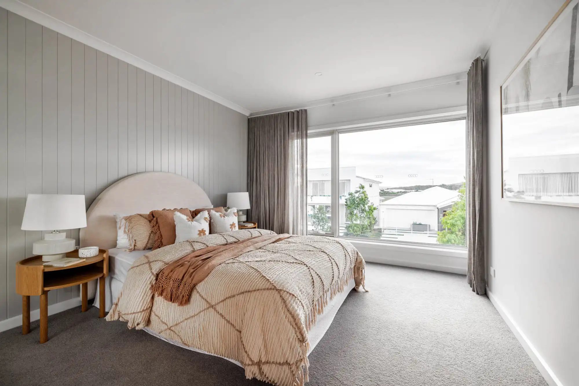 coastal-style interiors with wood cladding wall in a grey tone palette with a huge window for extra sunlight at travertine 31 bells creek