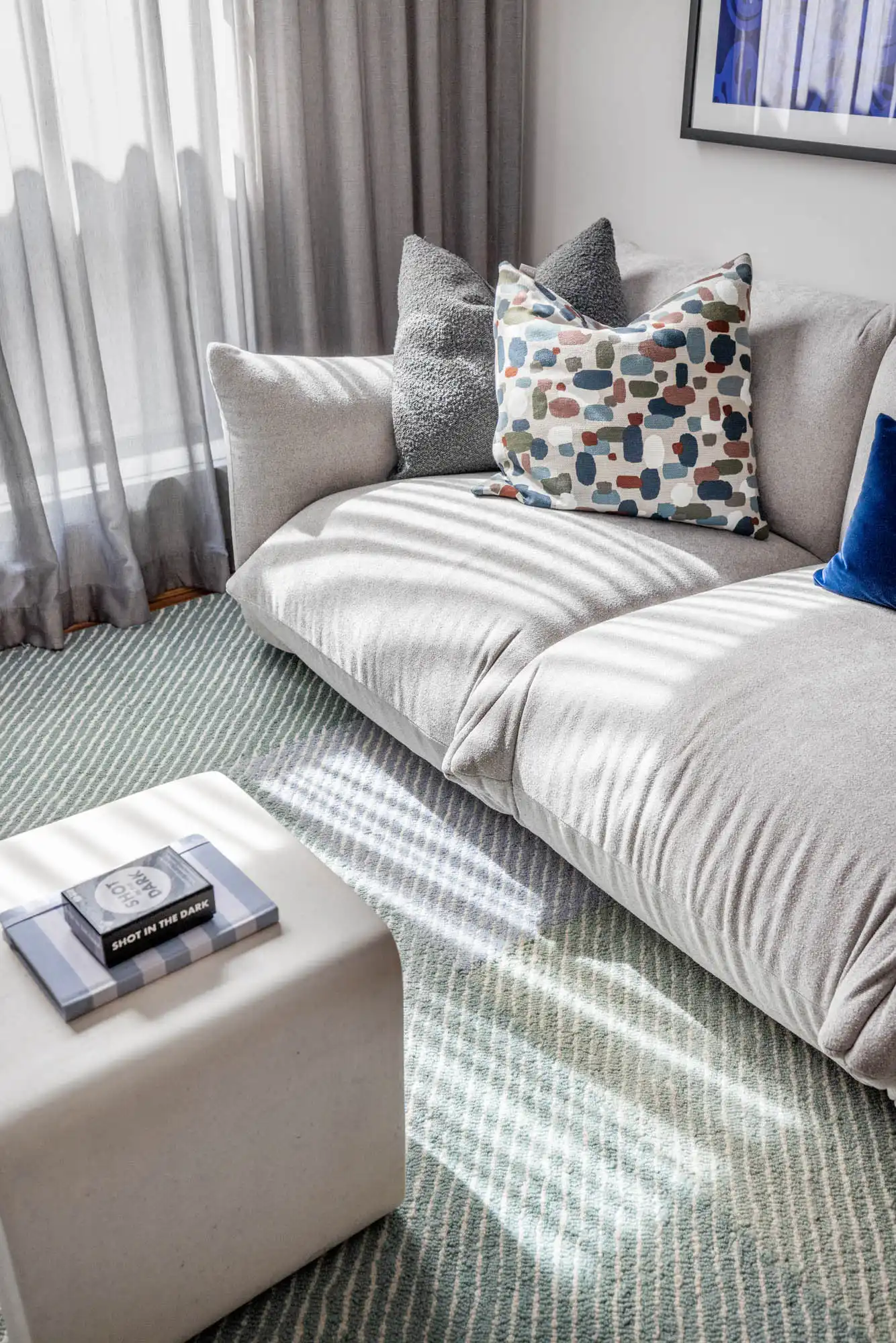 big couch and a statement artwork for a home theatre at victor 29