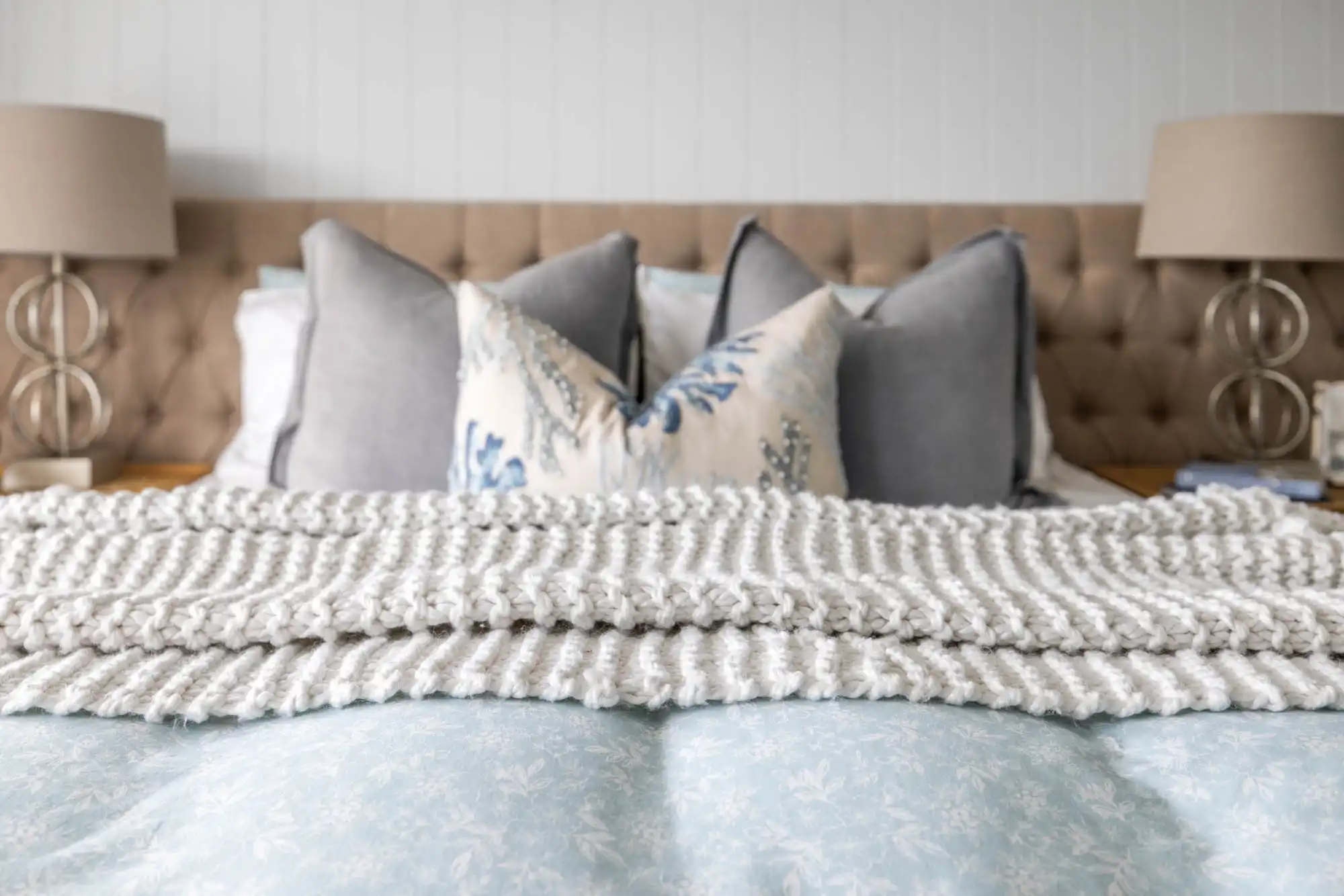 coastal hamptons bedroom style with wood cladding behind at granite 23