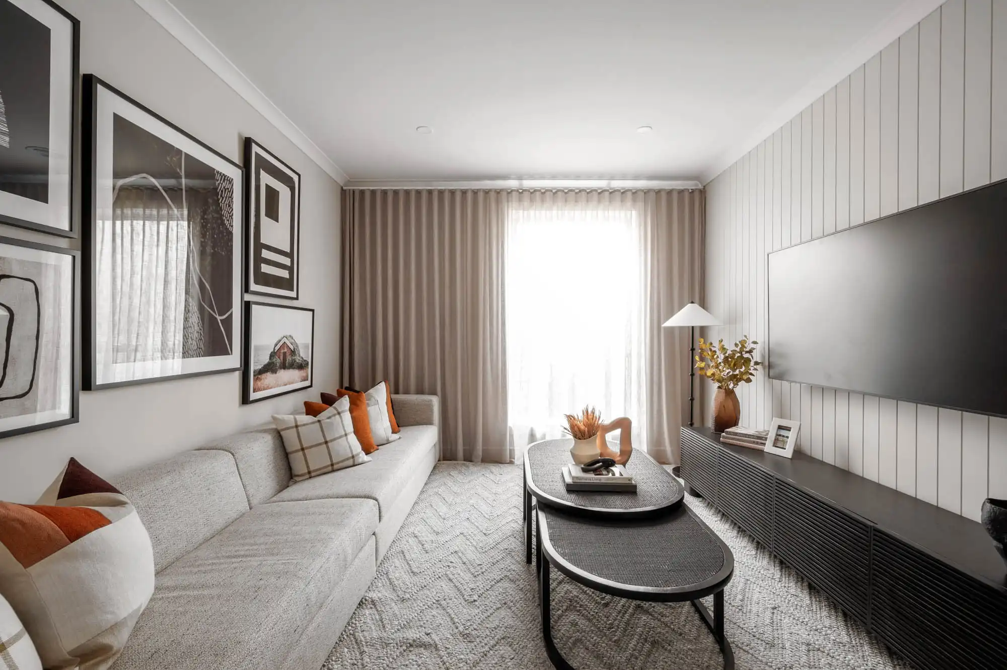 aesthetic wall cladding with vibrant pillows and a neutral couch at  26 lilydale