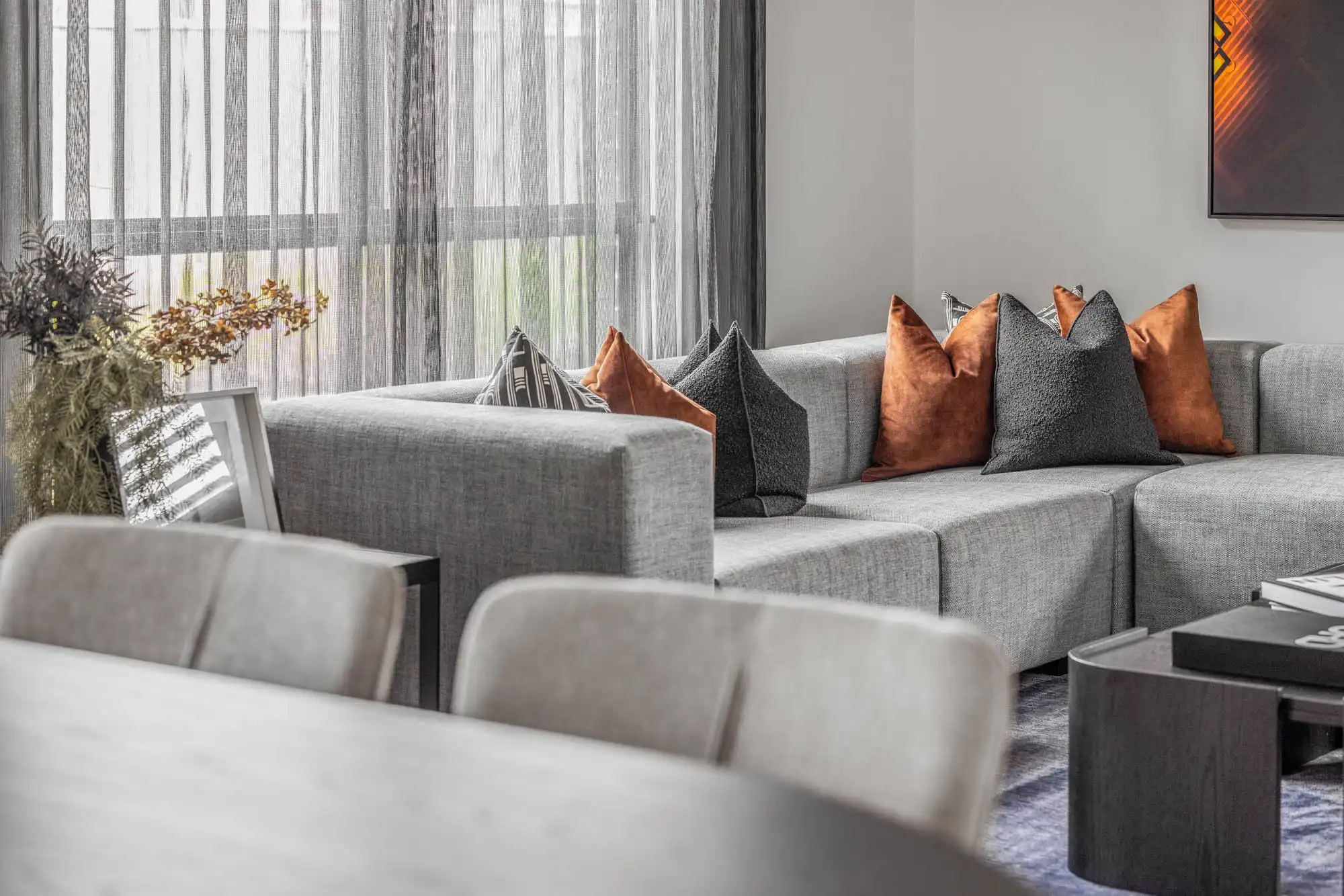 designing your living and dining area with consistent rich and neutral colour at lomandra 43