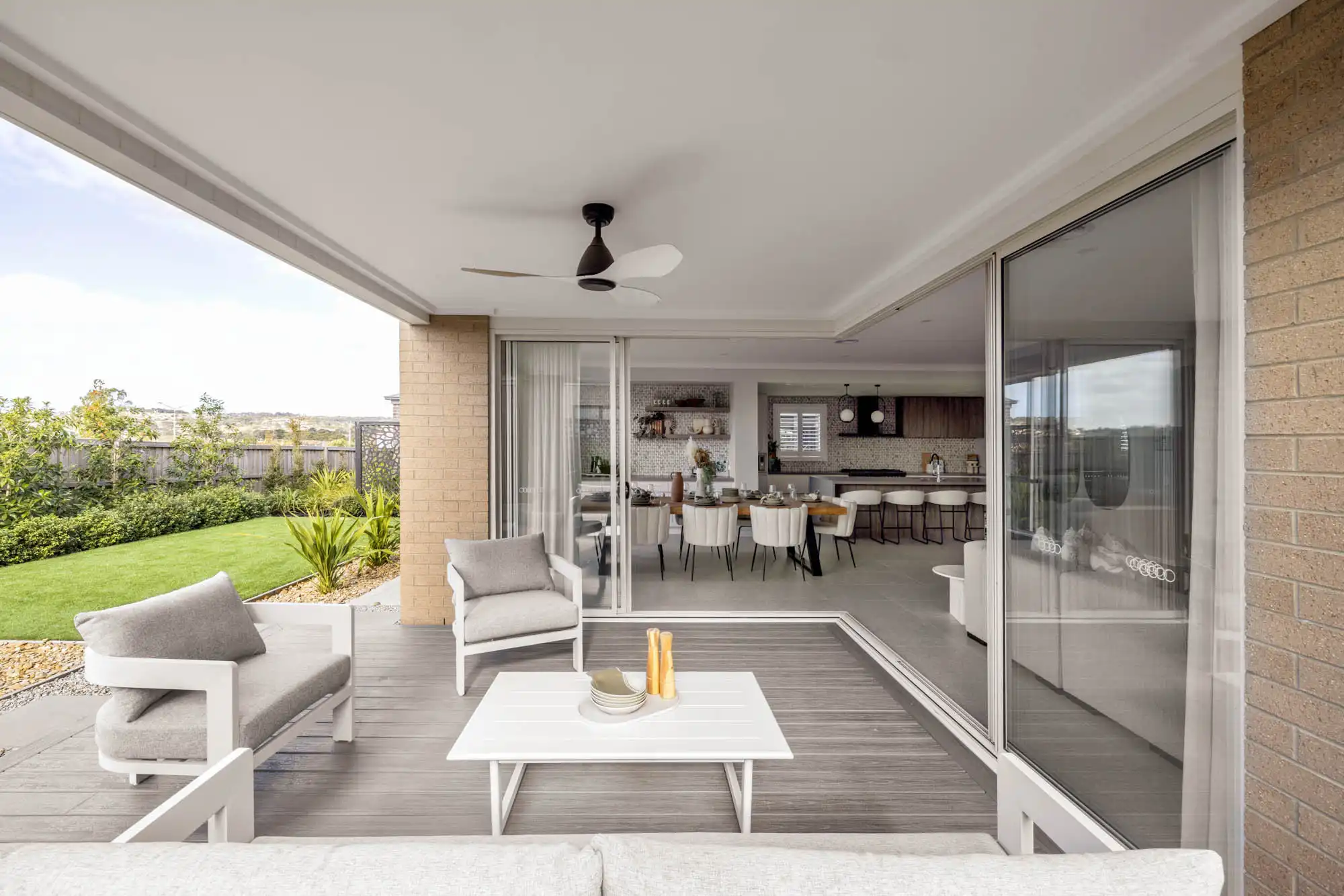 Designing the ideal indoor-outdoor space with doors connecting the alfresco and dining area at tallowood 52
