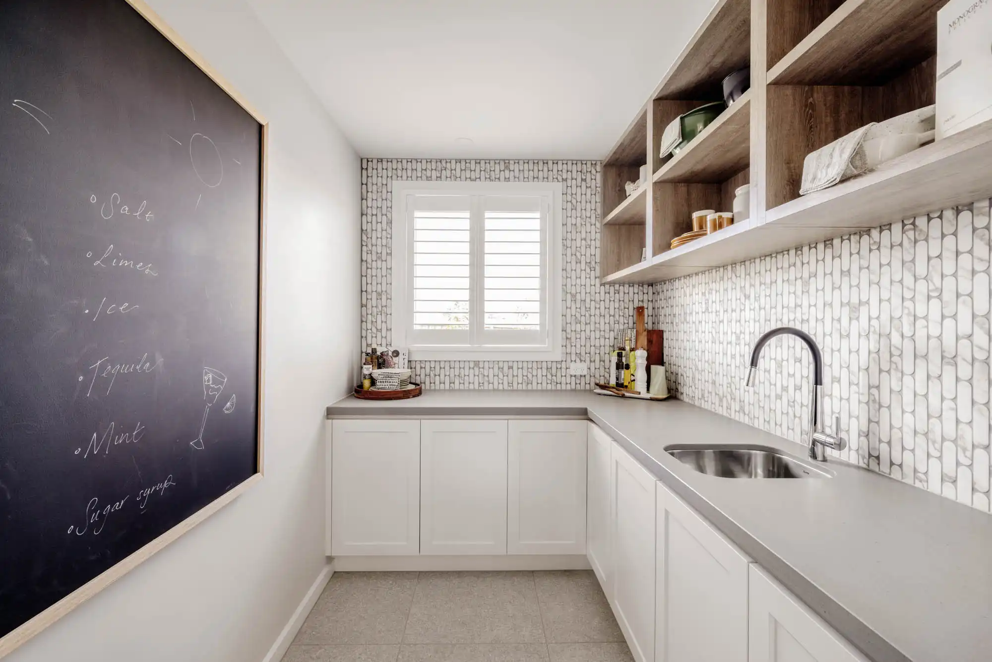 coastal style butler's pantry with mosaic tiling and timber shelving at tallowood 52