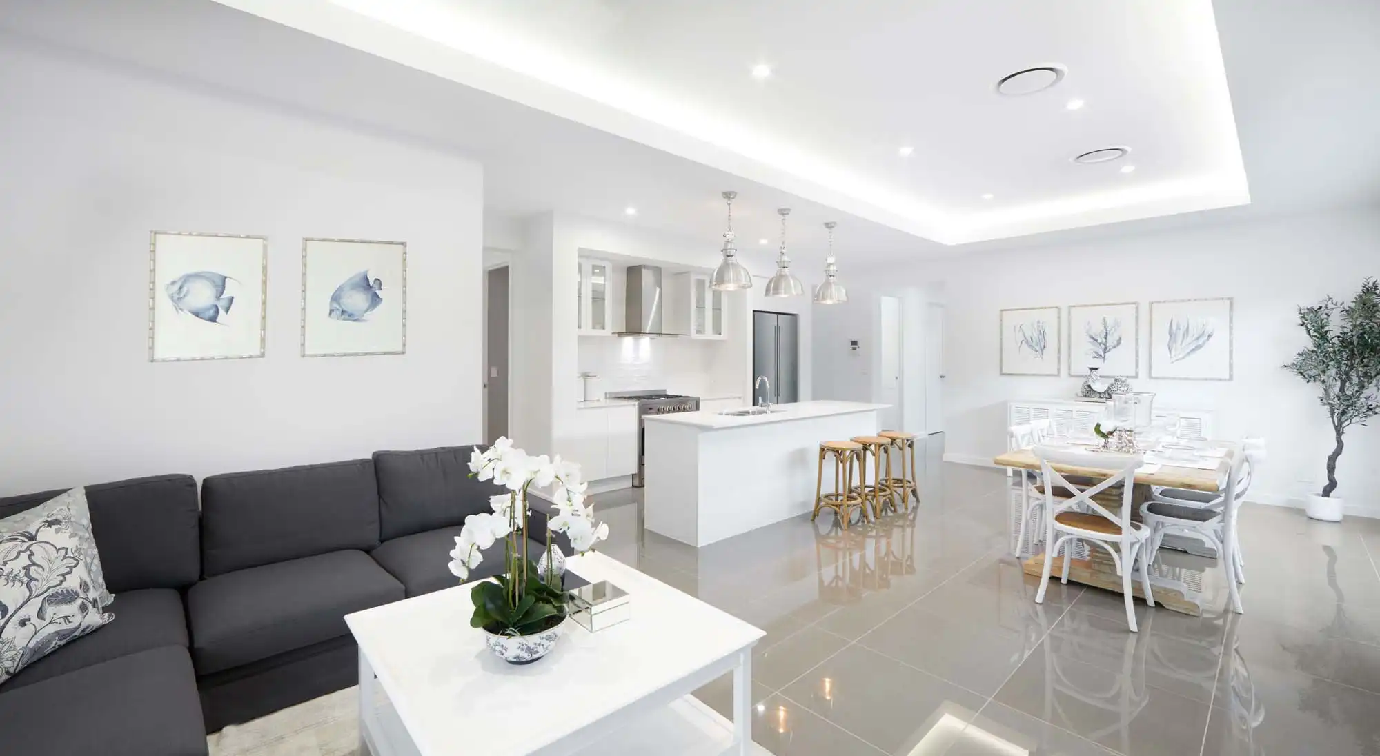 queensland coastal home design inspiration with raised ceilings and tiles throughout the home