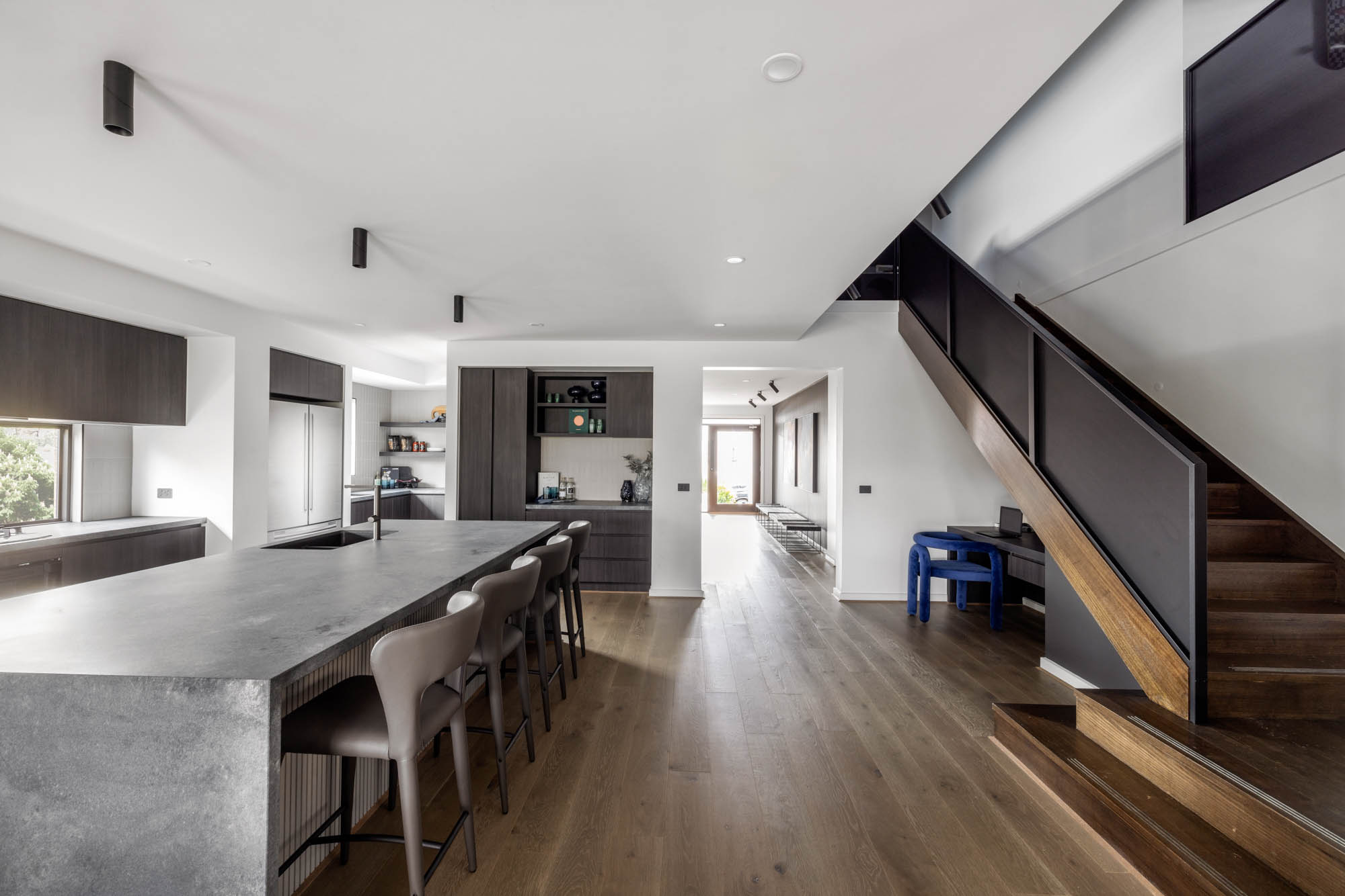 modern kitchen with timber accents light grey quartz countertops and stainless-steel appliances at silverton 45