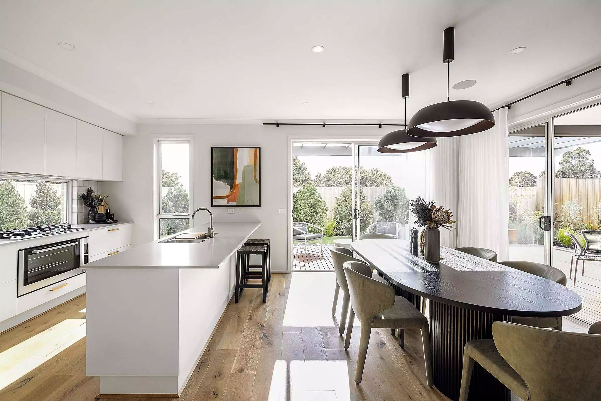 Open kitchen dining and alfresco space has a modern and traditional feel mood with modern appliances