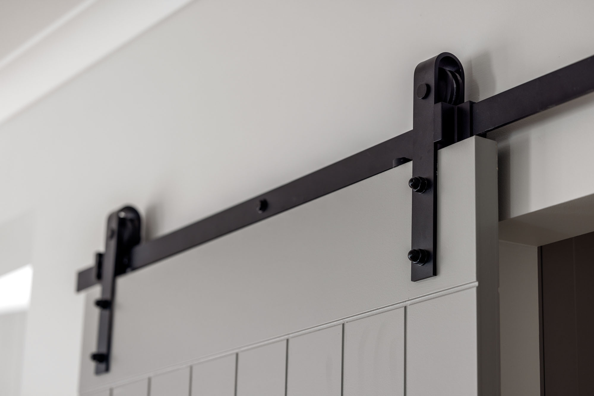 installing a barn-style door in your home for the butler's pantry with black detailing