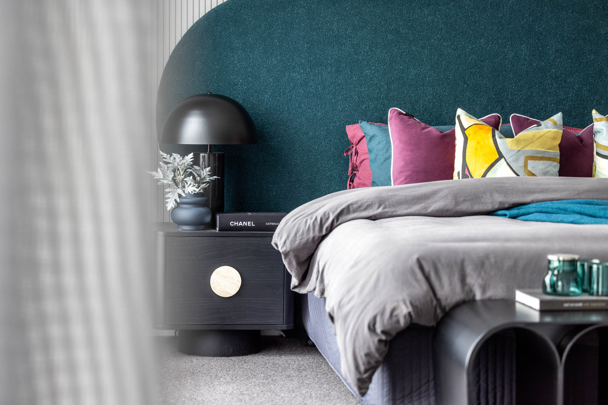 Image of a bedroom focusing on the cozy bedding and a bedside table next to it as a part of Simonds Silverton 45 home design.