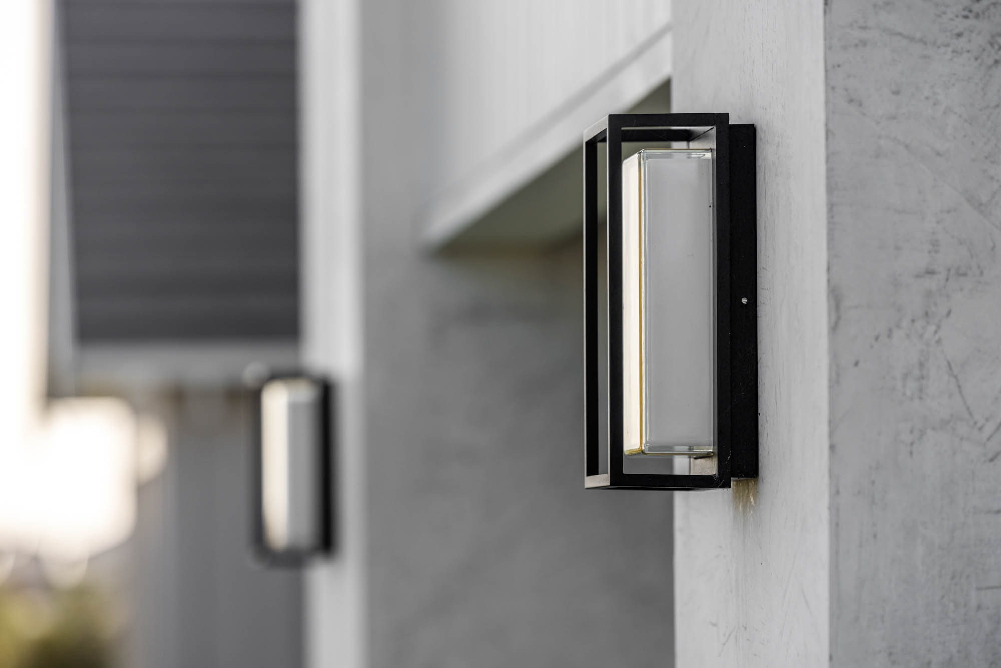An exterior image of a modern light as part of Simonds Tallowood home design.